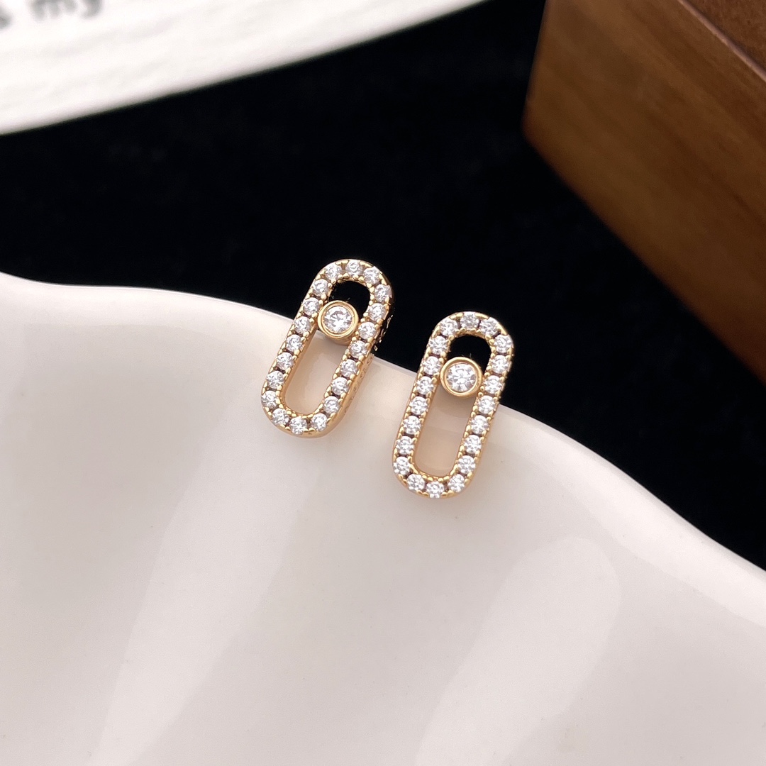 Messika Move Uno earrings Yellow gold with clear pave diamonds and central moving diamond 10mm stud length