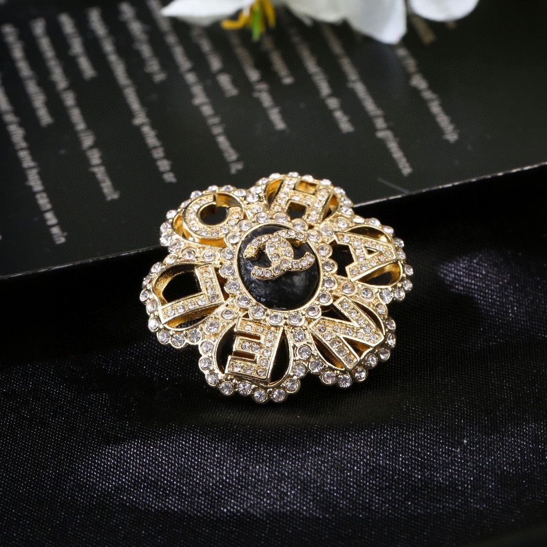 Chanel CC Logo Letter Flower Brooch brooch gold-tone metal clear crystal black enamel 3 5cm diameter