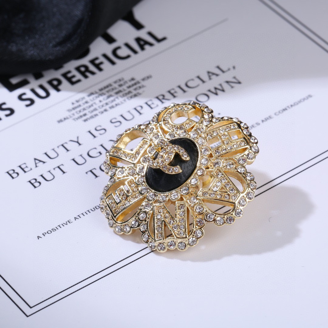 Chanel CC Logo Letter Flower Brooch brooch gold-tone metal clear crystal black enamel 3 5cm diameter