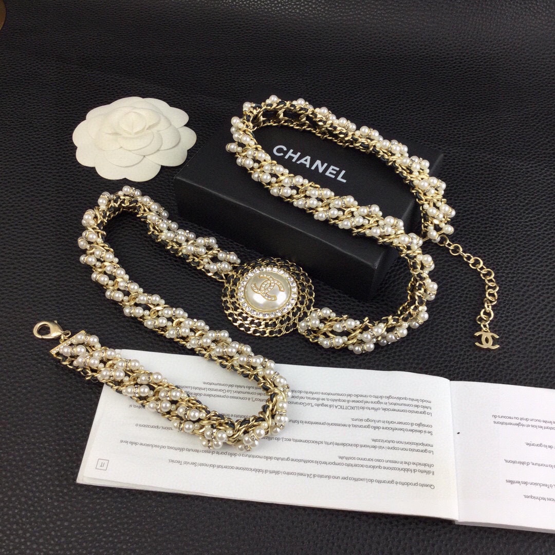 Chanel CC Logo Pearl Chain Medallion necklace gold-tone metal cream white faux pearls clear crystal rhinestones black leather chain accents 42cm with 5cm extender