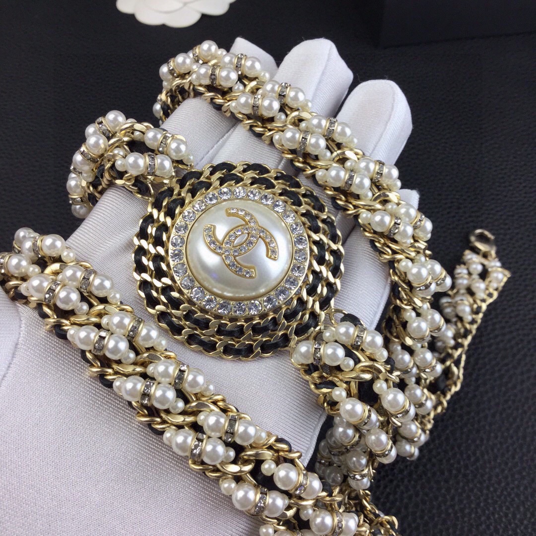 Chanel CC Logo Pearl Chain Medallion necklace gold-tone metal cream white faux pearls clear crystal rhinestones black leather chain accents 42cm with 5cm extender