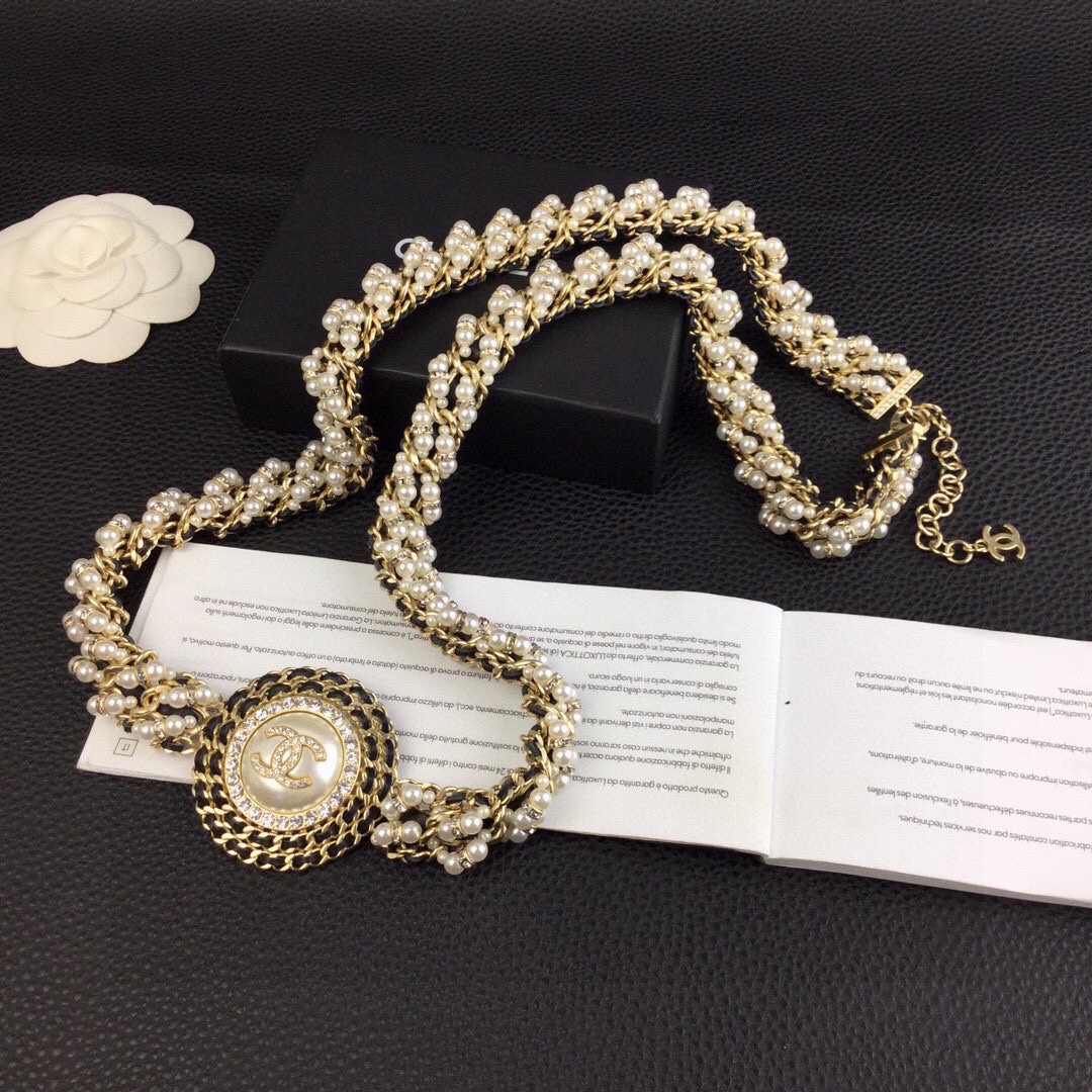 Chanel CC Logo Pearl Chain Medallion necklace gold-tone metal cream white faux pearls clear crystal rhinestones black leather chain accents 42cm with 5cm extender