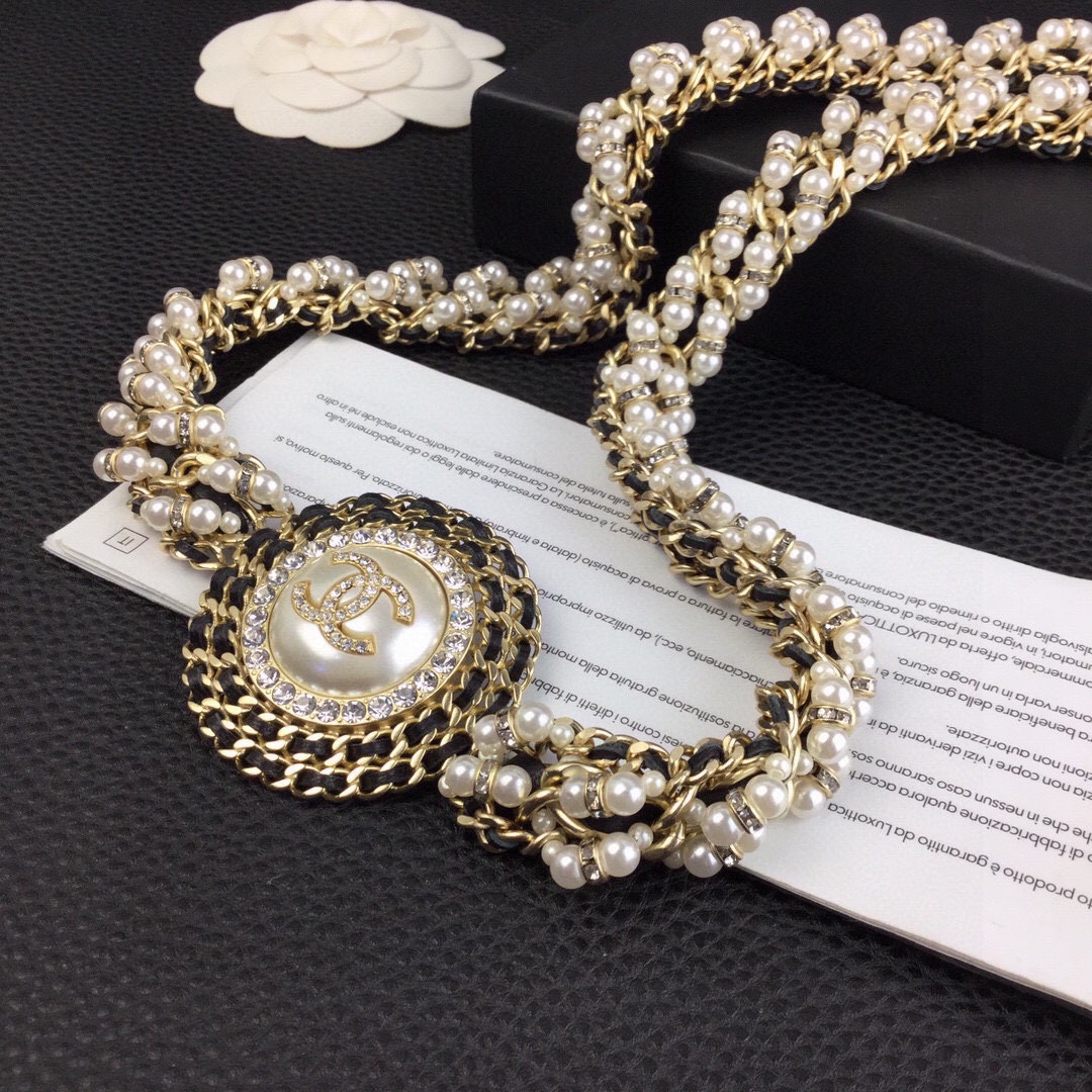 Chanel CC Logo Pearl Chain Medallion necklace gold-tone metal cream white faux pearls clear crystal rhinestones black leather chain accents 42cm with 5cm extender