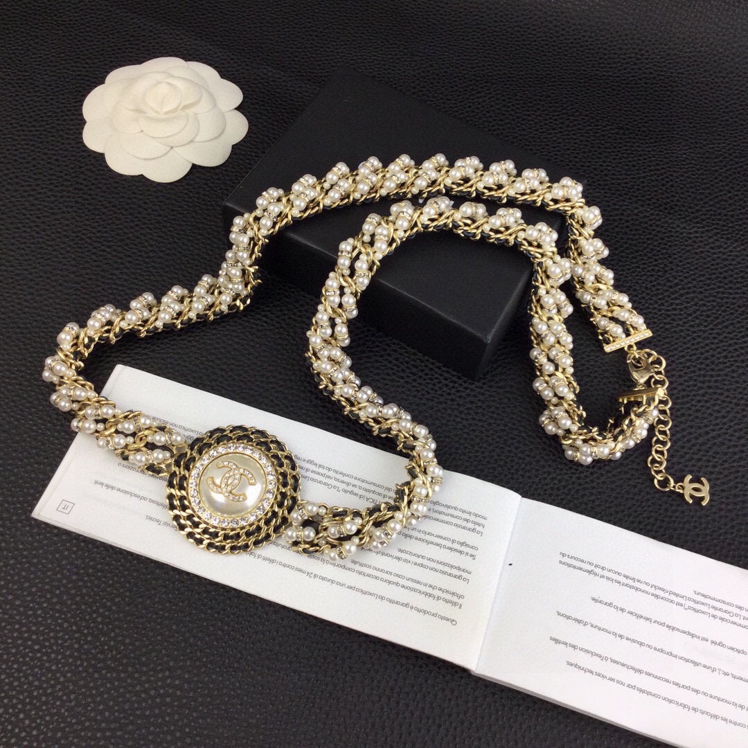 Chanel CC Logo Pearl Chain Medallion necklace gold-tone metal cream white faux pearls clear crystal rhinestones black leather chain accents 42cm with 5cm extender
