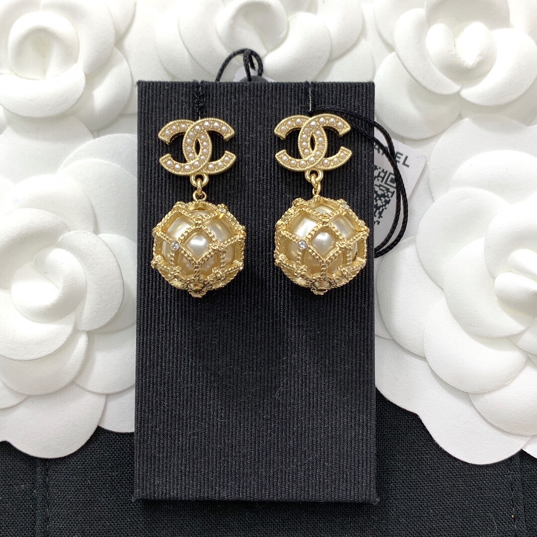 Chanel CC Logo Caged Pearl Drop Earrings earrings Gold-tone metal with cream faux pearls and clear crystal accents Drop length approximately 3cm