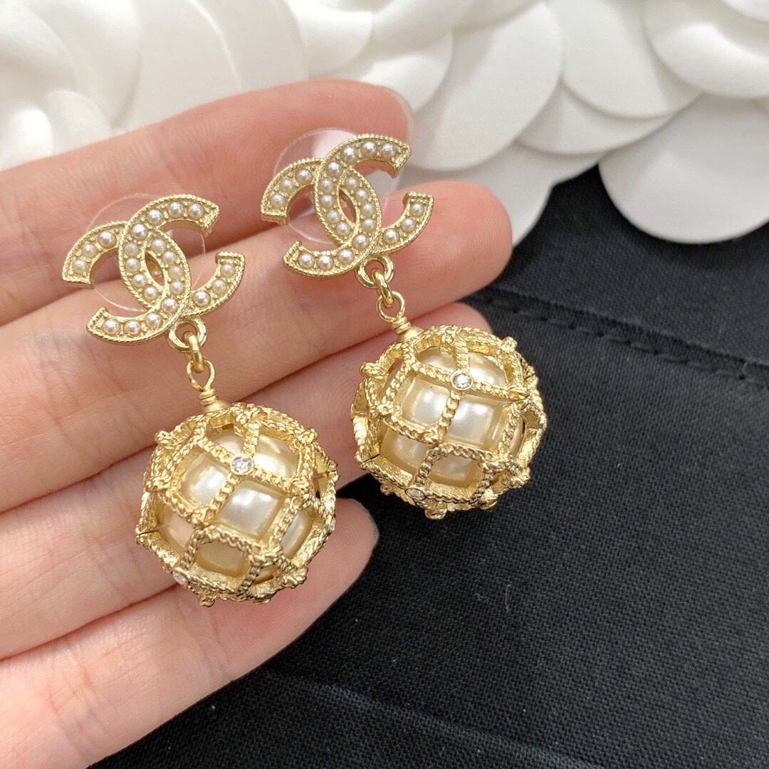 Chanel CC Logo Caged Pearl Drop Earrings earrings Gold-tone metal with cream faux pearls and clear crystal accents Drop length approximately 3cm
