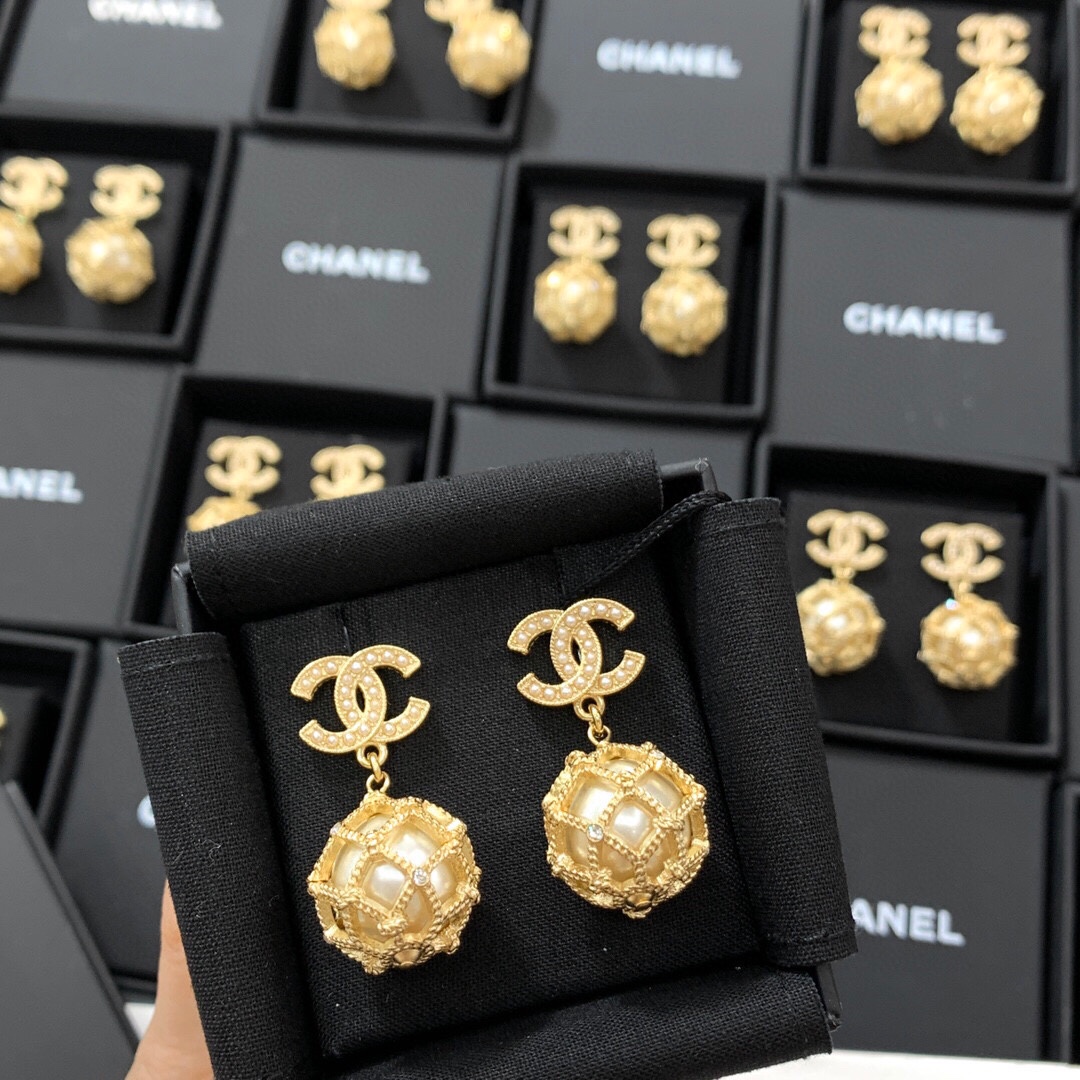 Chanel CC Logo Caged Pearl Drop Earrings earrings Gold-tone metal with cream faux pearls and clear crystal accents Drop length approximately 3cm