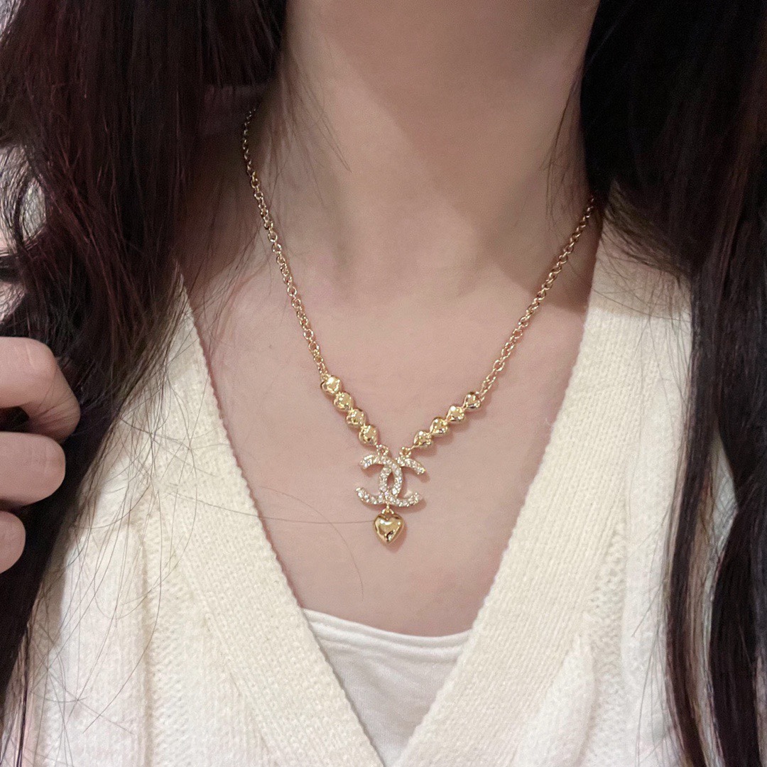 Chanel CC Heart Drop Necklace necklace Gold-tone metal with clear crystal accents and gold heart charm 42cm