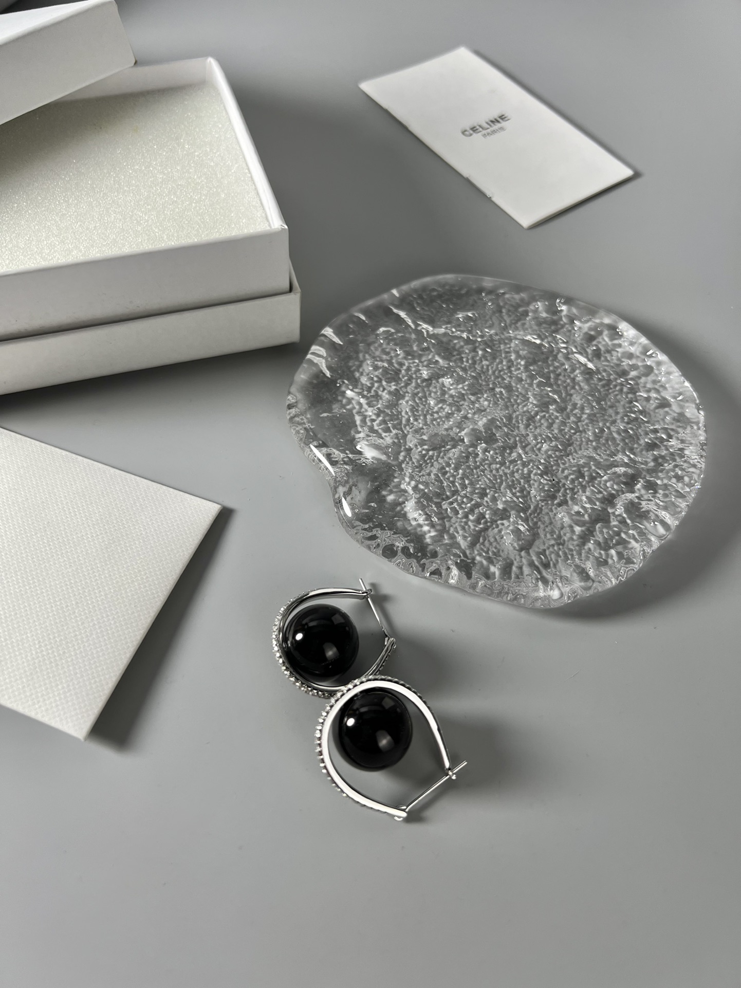 Celine YHED045 Black Ball Hoop Earrings earrings Rhodium-plated silver-toned metal with glossy black spherical cabochons and clear pave crystal accents 3cm hoop diameter