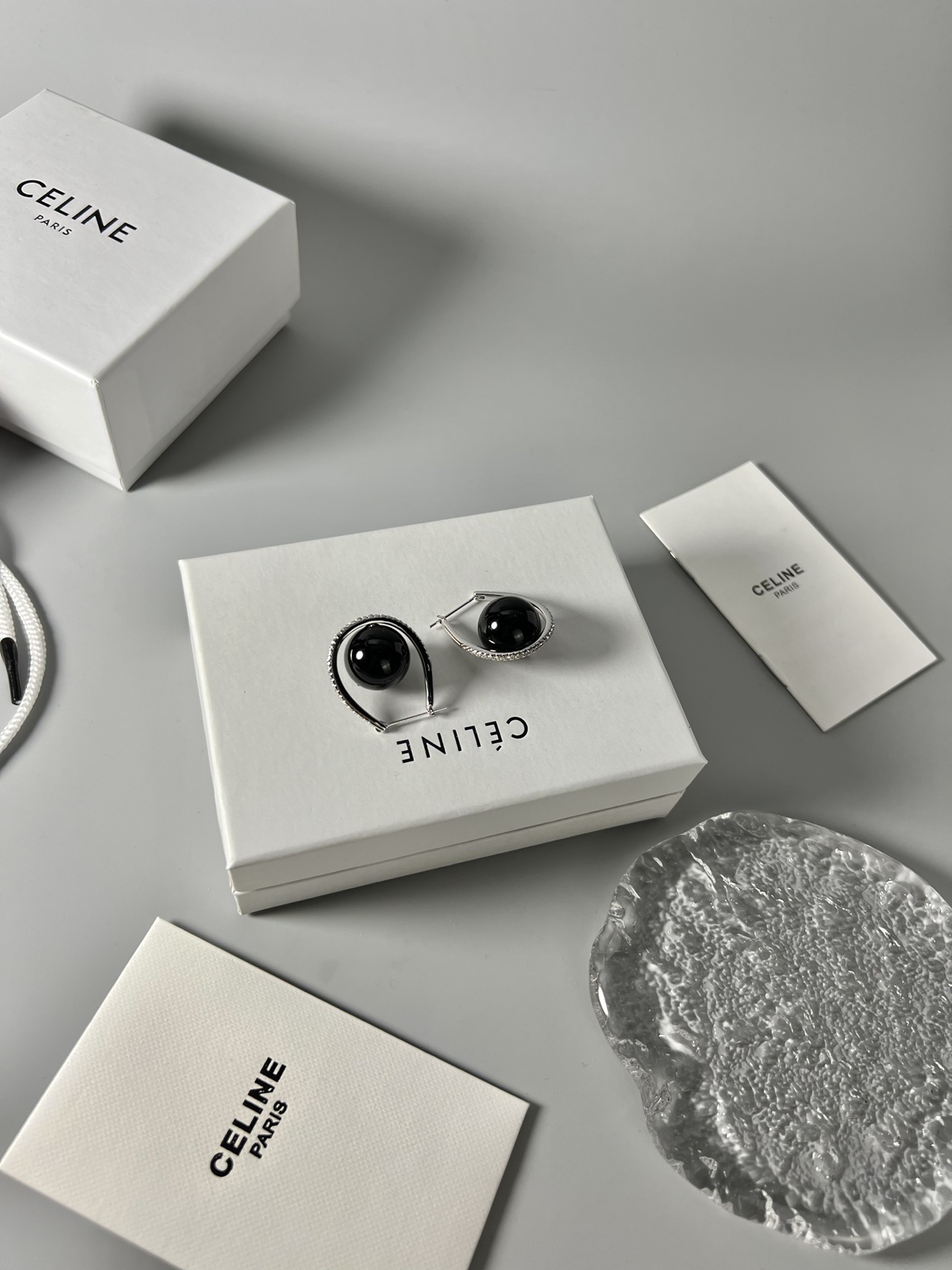 Celine YHED045 Black Ball Hoop Earrings earrings Rhodium-plated silver-toned metal with glossy black spherical cabochons and clear pave crystal accents 3cm hoop diameter