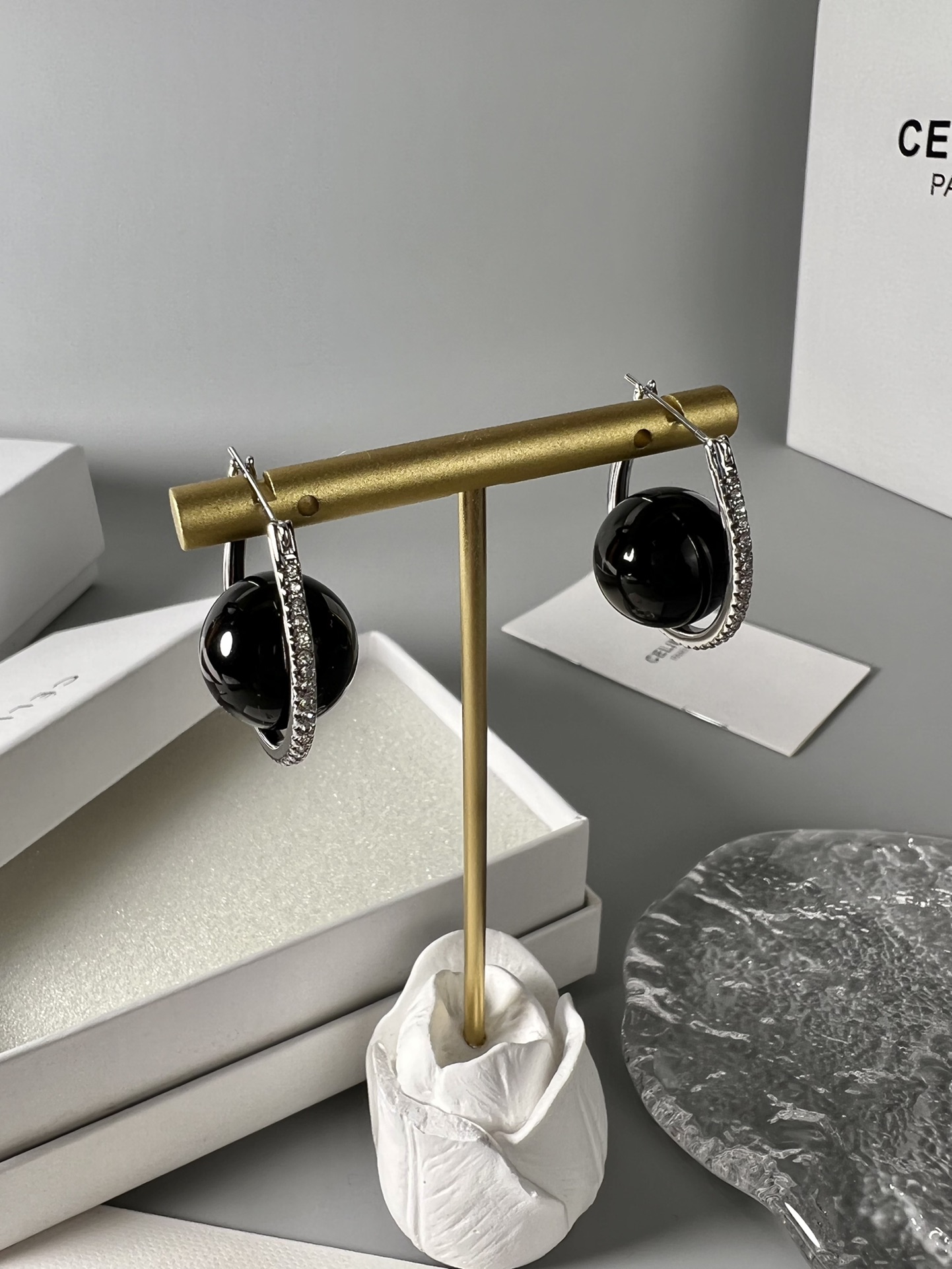 Celine YHED045 Black Ball Hoop Earrings earrings Rhodium-plated silver-toned metal with glossy black spherical cabochons and clear pave crystal accents 3cm hoop diameter