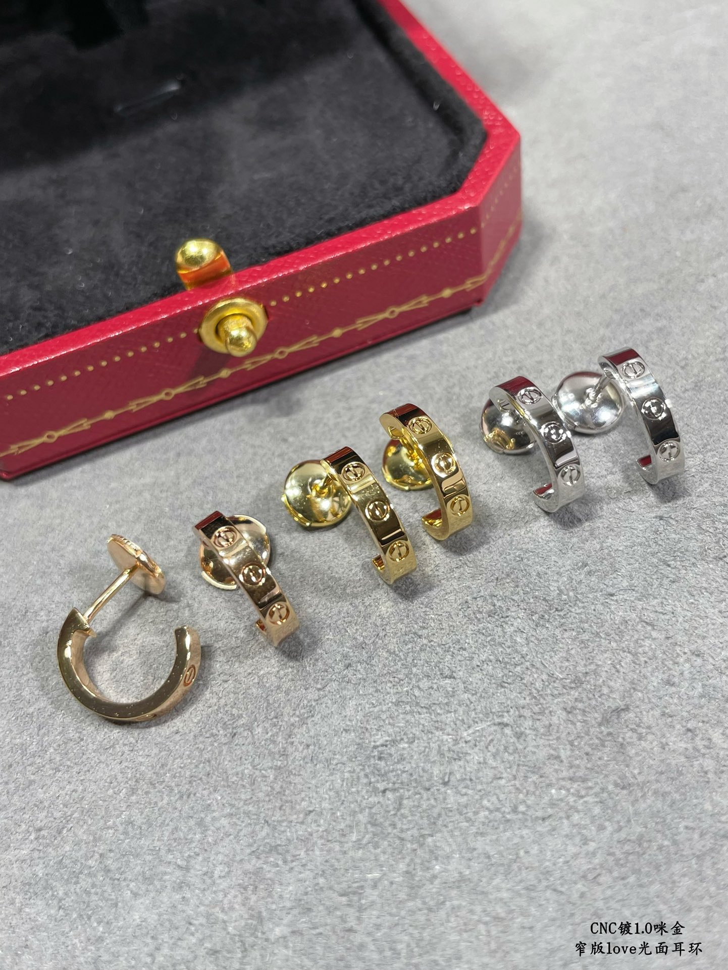 Cartier LOVE earrings 18k yellow gold 18k white gold no gemstones polished plain metal finish narrow version hoop earrings inner diameter approximately 8mm