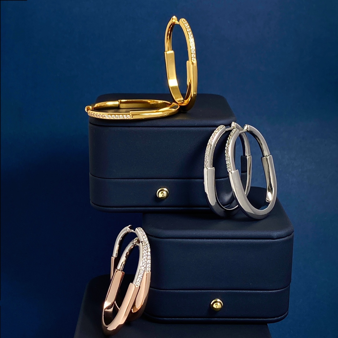 Tiffany Lock Hoop Earrings earrings Yellow gold with clear diamond accents available in white gold and rose gold variants 25mm hoop diameter