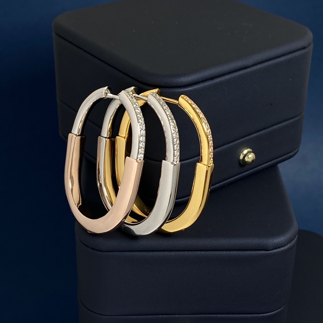 Tiffany Lock Hoop Earrings earrings Yellow gold with clear diamond accents available in white gold and rose gold variants 25mm hoop diameter