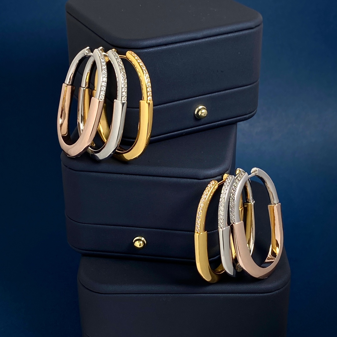 Tiffany Lock Hoop Earrings earrings Yellow gold with clear diamond accents available in white gold and rose gold variants 25mm hoop diameter