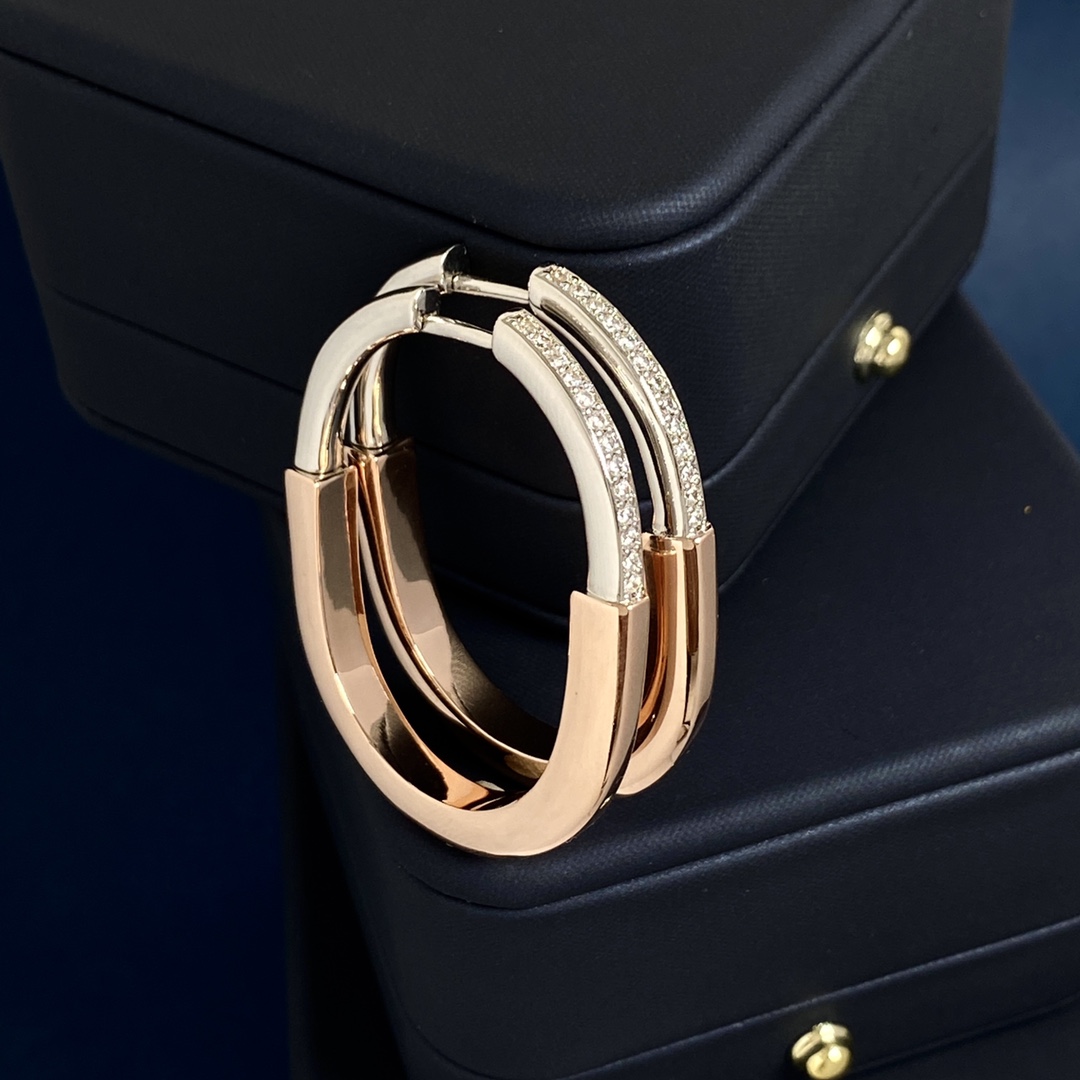 Tiffany Lock Hoop Earrings earrings Yellow gold with clear diamond accents available in white gold and rose gold variants 25mm hoop diameter