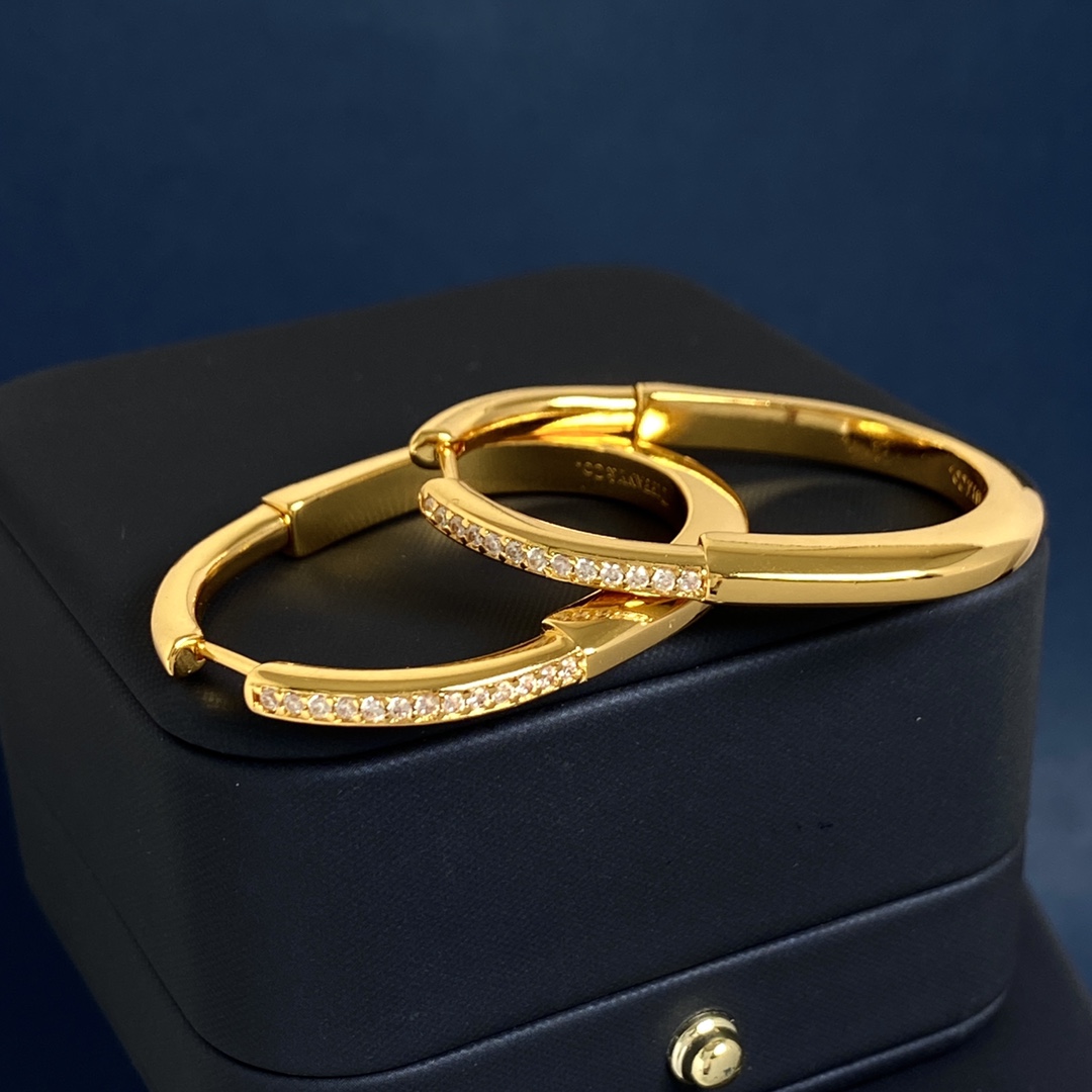 Tiffany Lock Hoop Earrings earrings Yellow gold with clear diamond accents available in white gold and rose gold variants 25mm hoop diameter