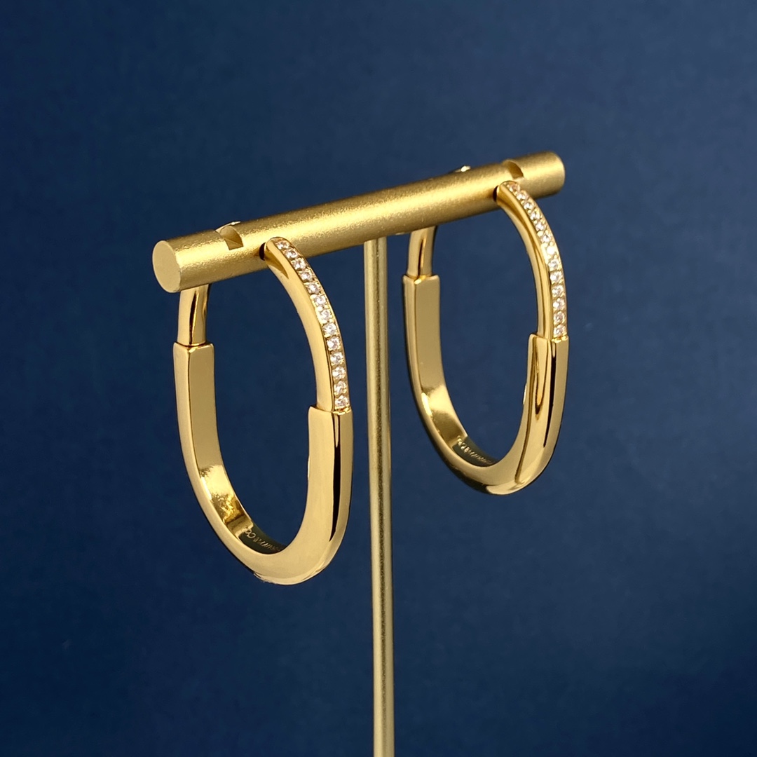 Tiffany Lock Hoop Earrings earrings Yellow gold with clear diamond accents available in white gold and rose gold variants 25mm hoop diameter