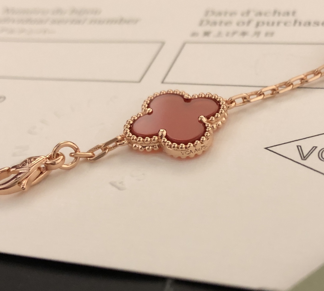 Van Cleef Arpels Vintage Alhambra bracelet 18k yellow gold with burgundy carnelian and clear diamond accents 18cm