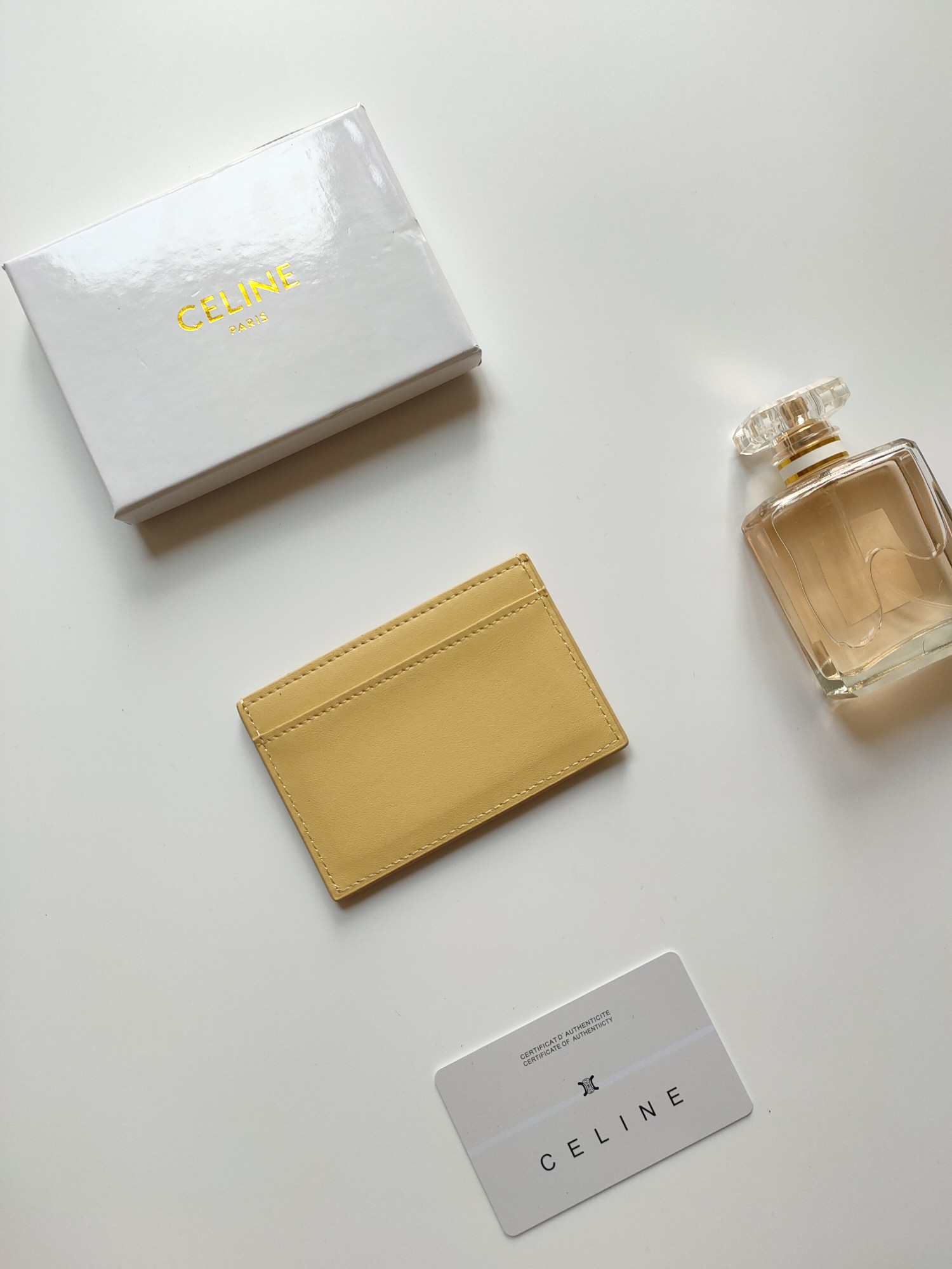 Celine Triomphe card holder pastel yellow smooth leather with matching tone embossed Triomphe logo 10 5 x 7cm