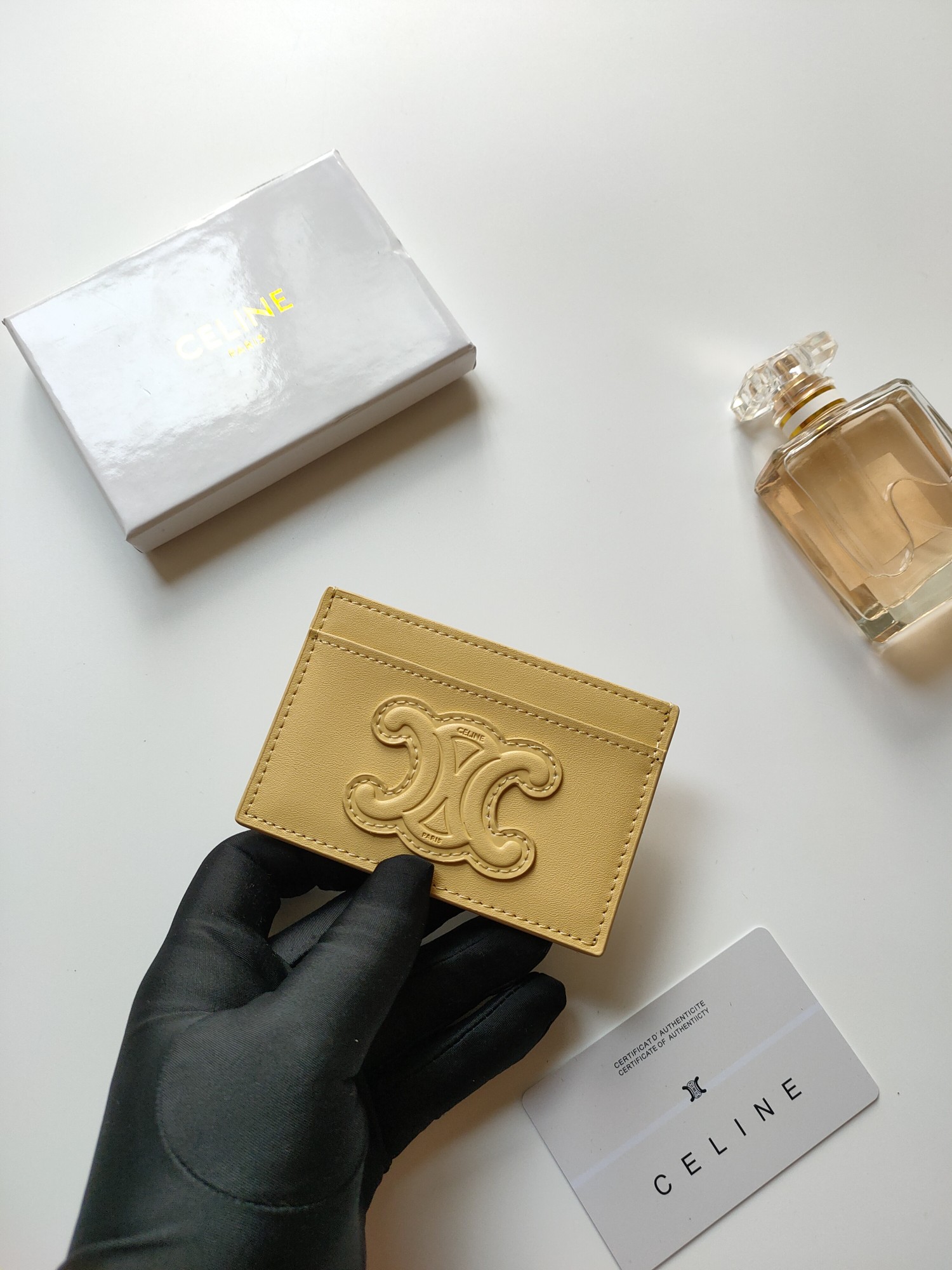 Celine Triomphe card holder pastel yellow smooth leather with matching tone embossed Triomphe logo 10 5 x 7cm