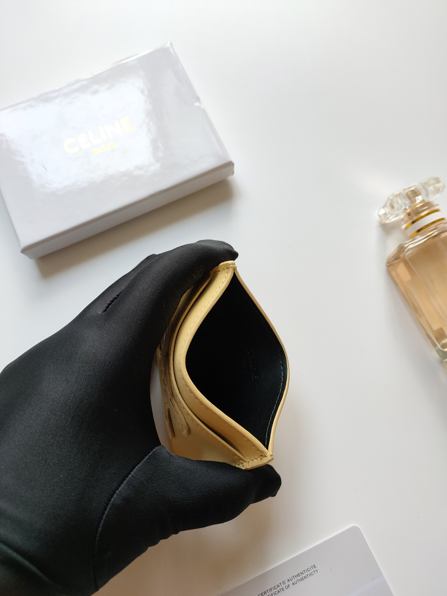 Celine Triomphe card holder pastel yellow smooth leather with matching tone embossed Triomphe logo 10 5 x 7cm