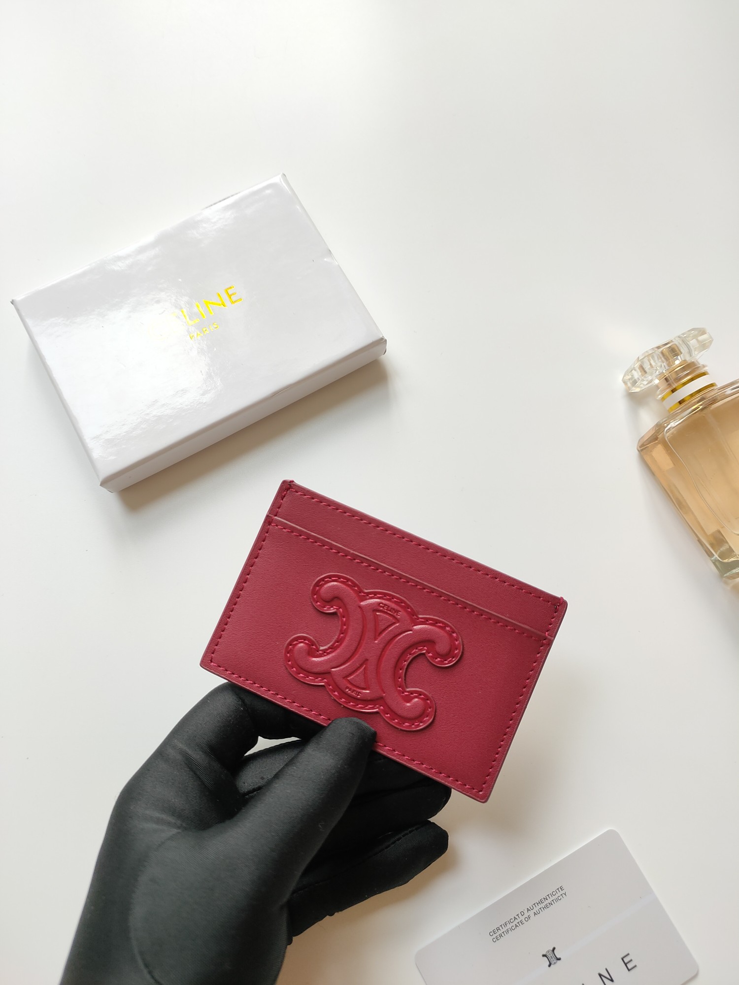 Celine Triomphe card holder Burgundy smooth calfskin leather with matching tone Triomphe logo embossment 7cm x 10 5cm