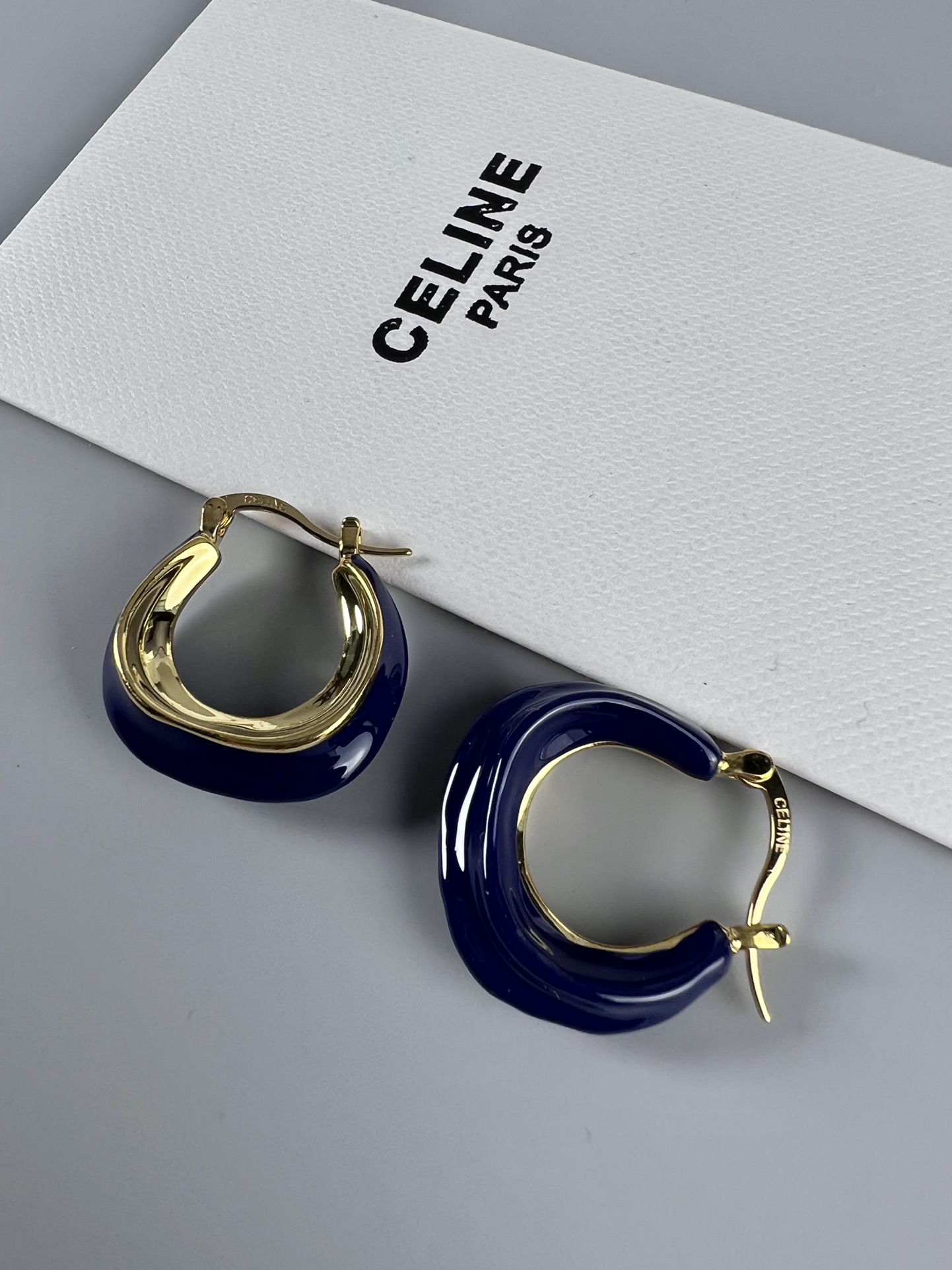 Celine Layered Hoop Earrings earrings Gold-tone metal one variant with navy blue enamel one variant in polished gold 2 5cm diameter