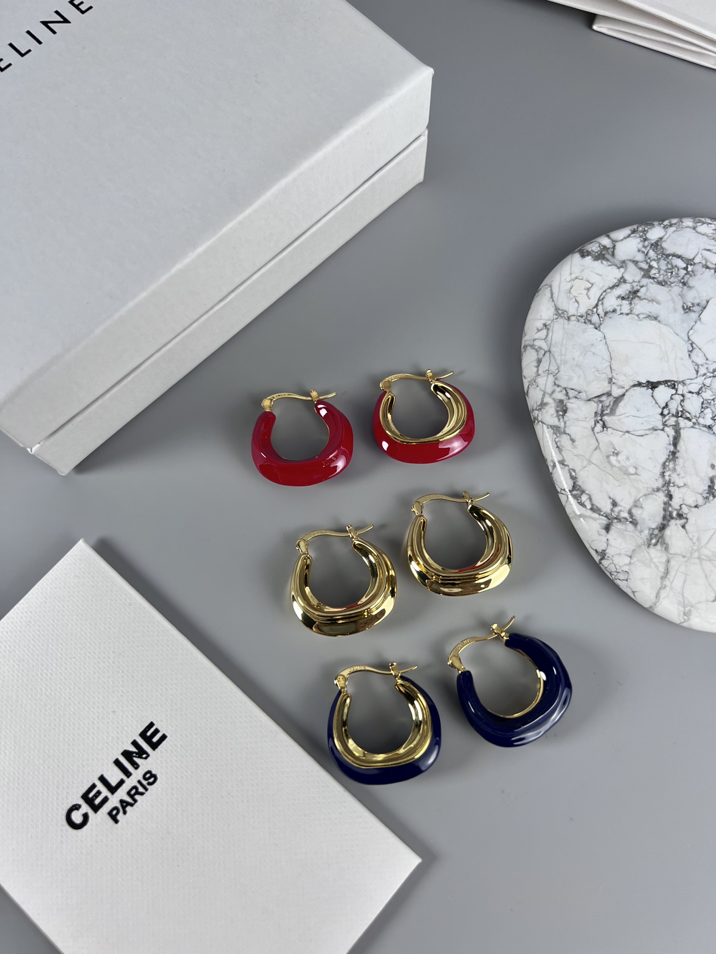 Celine Layered Hoop Earrings earrings Gold-tone metal one variant with navy blue enamel one variant in polished gold 2 5cm diameter