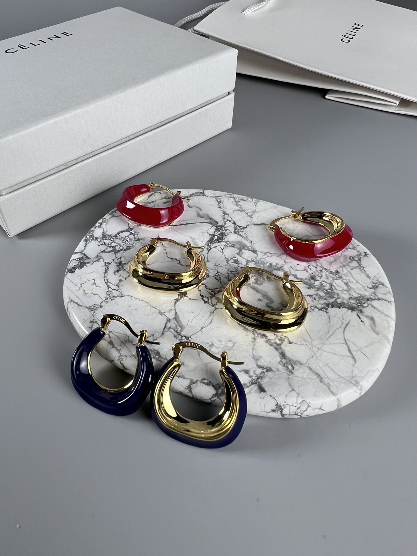 Celine Layered Hoop Earrings earrings Gold-tone metal one variant with navy blue enamel one variant in polished gold 2 5cm diameter