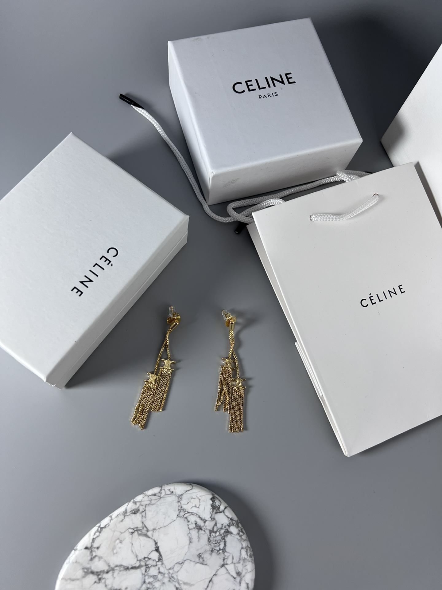 Celine Triomphe Multi-Tassel Chain Drop Earrings earrings Available in polished silver-tone metal and polished gold-tone metal no accent stones 7cm drop length