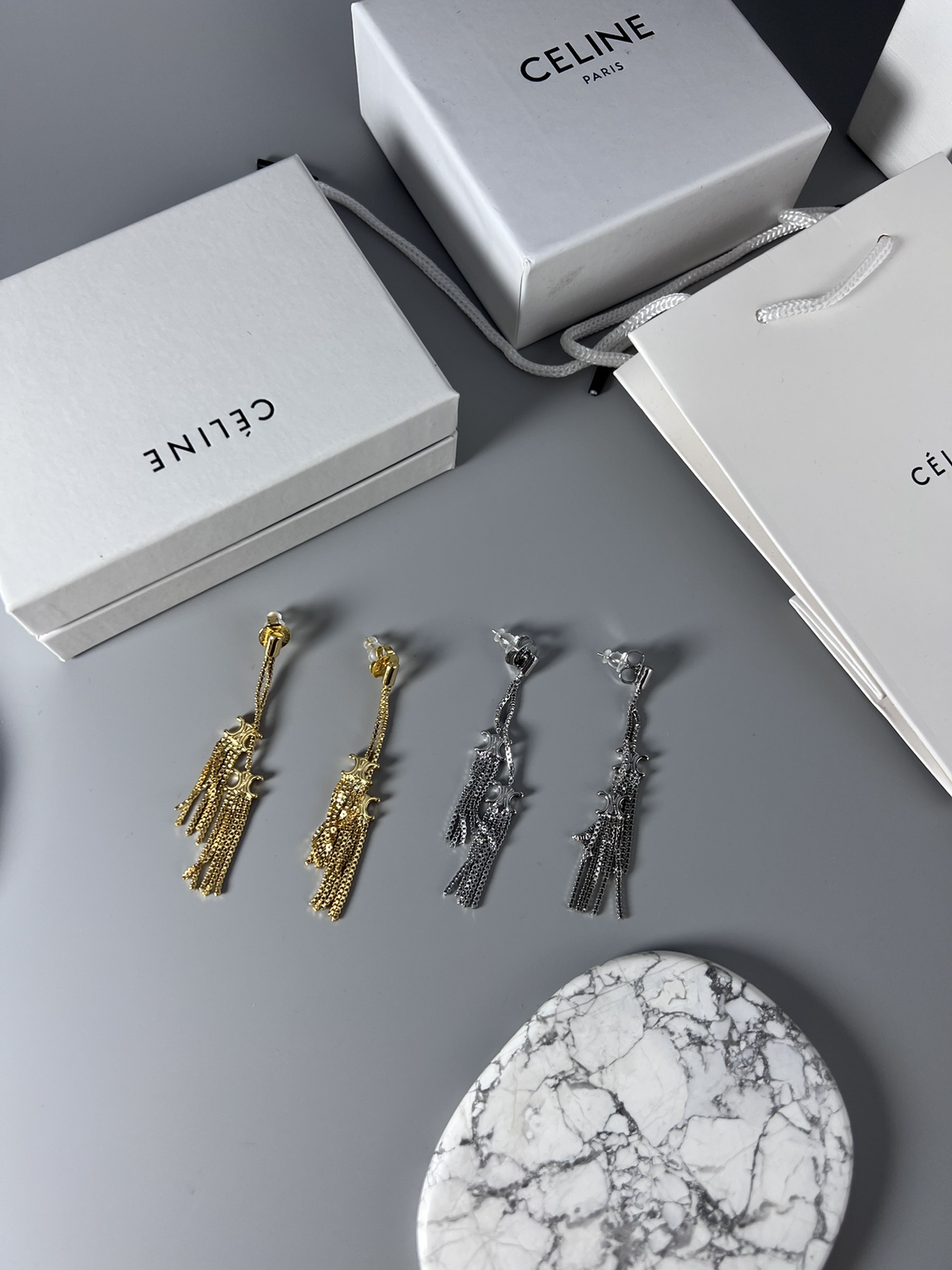 Celine Triomphe Multi-Tassel Chain Drop Earrings earrings Available in polished silver-tone metal and polished gold-tone metal no accent stones 7cm drop length