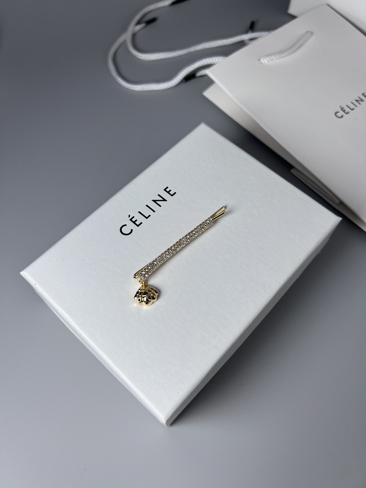 Celine Crystal Shell Charm Bobby Pin brooch Gold-tone metal with clear crystals and dark blue accent stones Silver-tone metal with clear crystals and dark blue accent stones 6cm
