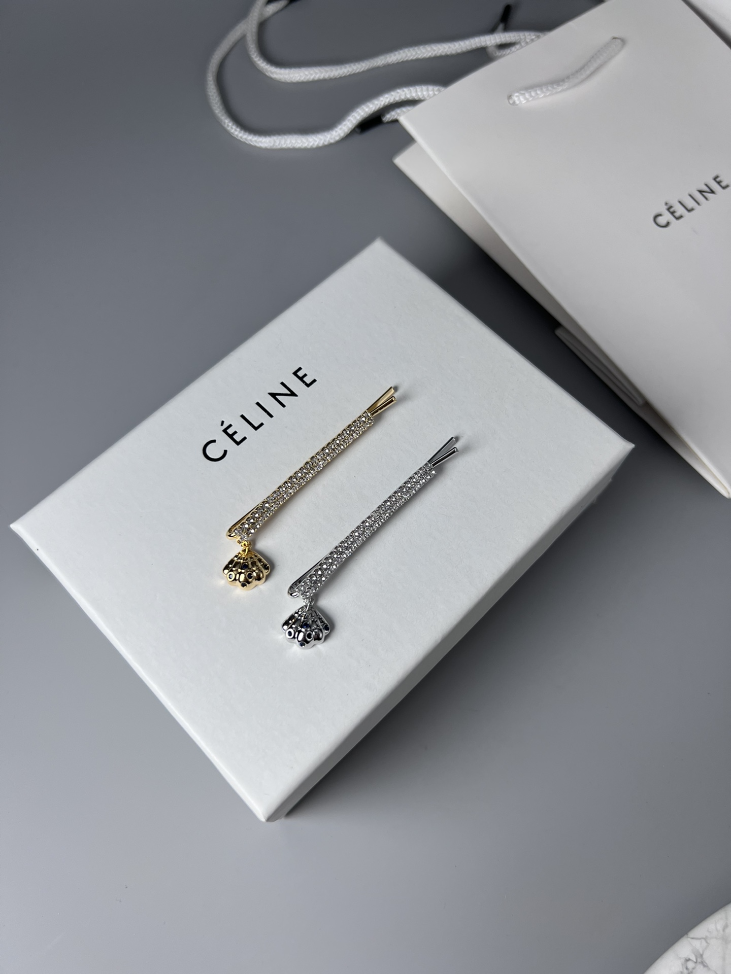 Celine Crystal Shell Charm Bobby Pin brooch Gold-tone metal with clear crystals and dark blue accent stones Silver-tone metal with clear crystals and dark blue accent stones 6cm