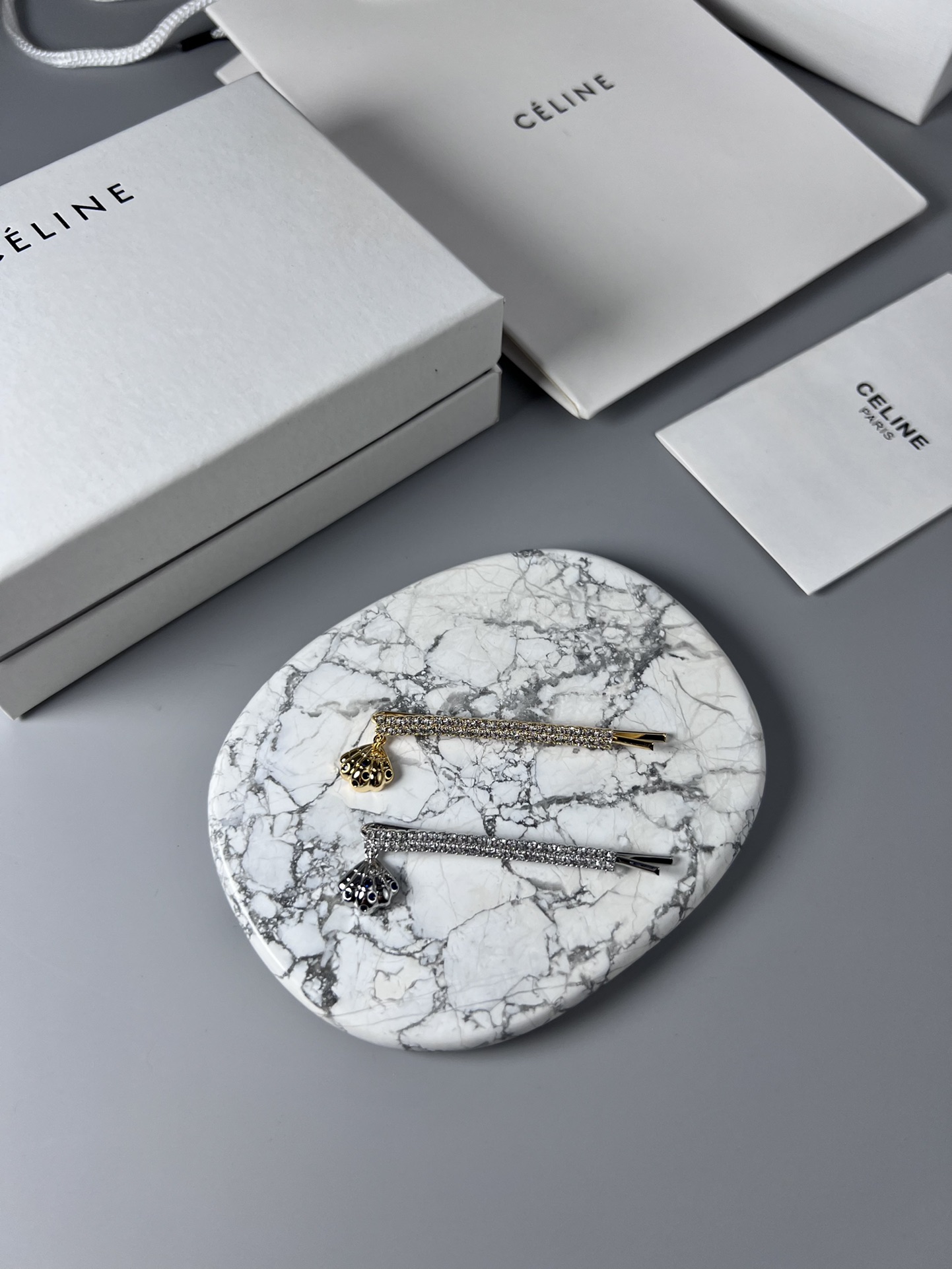 Celine Crystal Shell Charm Bobby Pin brooch Gold-tone metal with clear crystals and dark blue accent stones Silver-tone metal with clear crystals and dark blue accent stones 6cm
