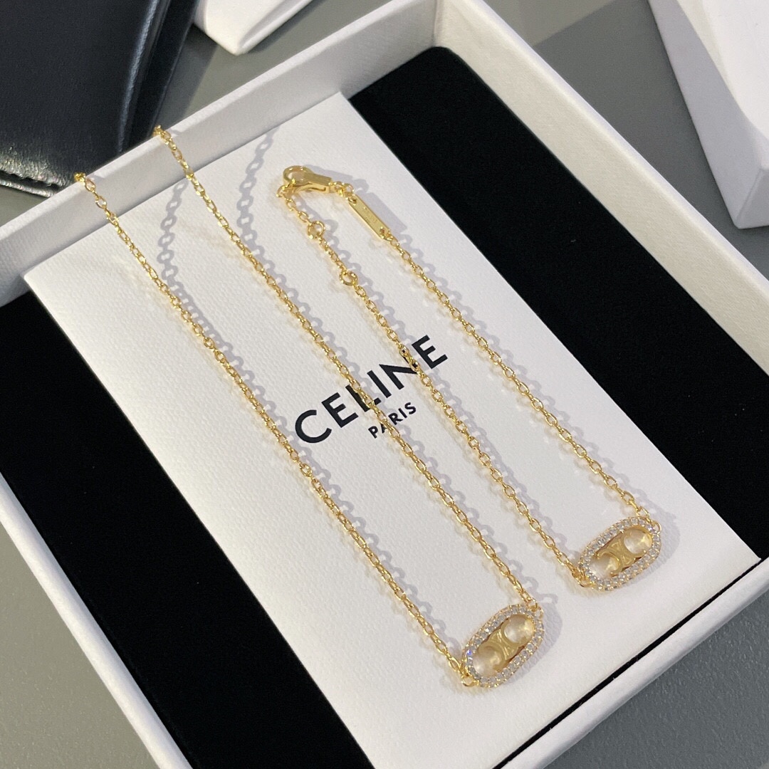 Celine Triomphe Oval Crystal Pearl bracelet gold-tone metal with clear crystals and white pearl accents 18cm