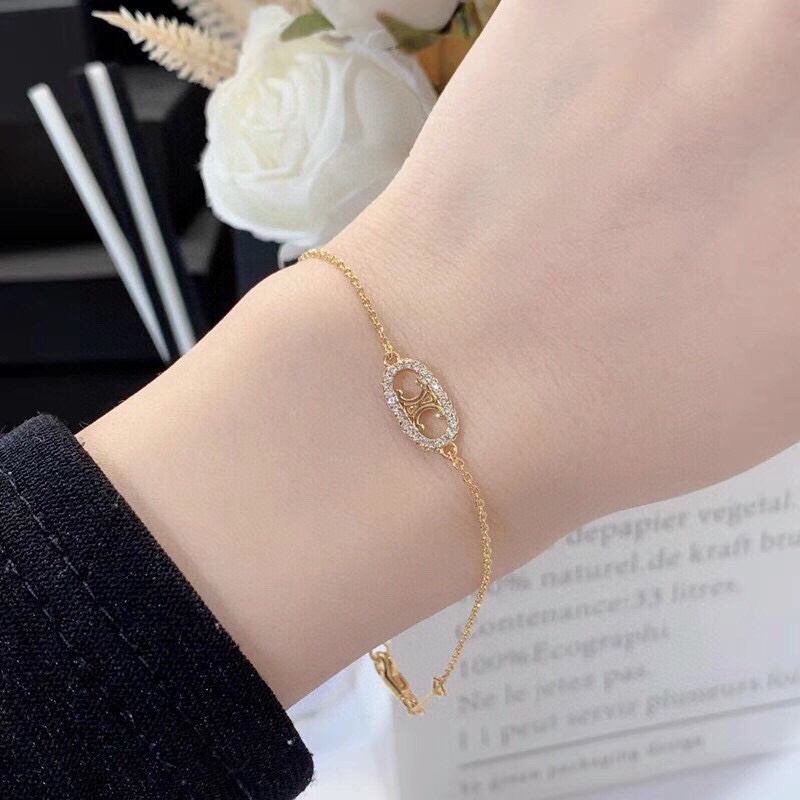 Celine Triomphe Oval Crystal Pearl bracelet gold-tone metal with clear crystals and white pearl accents 18cm