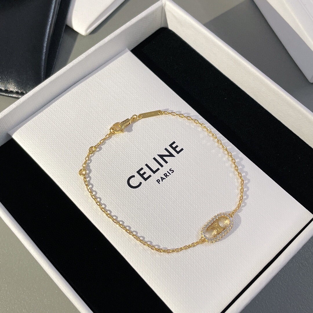 Celine Triomphe Oval Crystal Pearl bracelet gold-tone metal with clear crystals and white pearl accents 18cm