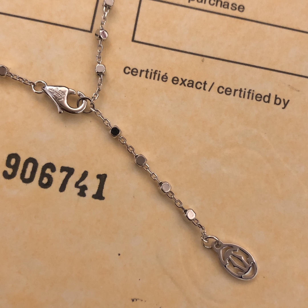 Cartier Panthere de Cartier necklace 18k white gold set with diamonds black onyx spots tsavorite garnet eyes 42cm
