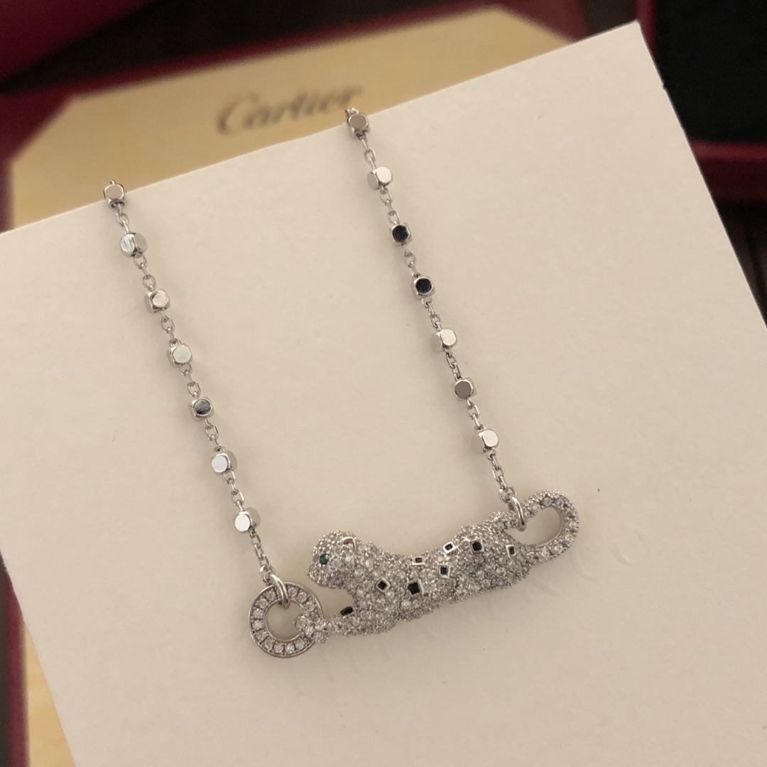 Cartier Panthere de Cartier necklace 18k white gold set with diamonds black onyx spots tsavorite garnet eyes 42cm
