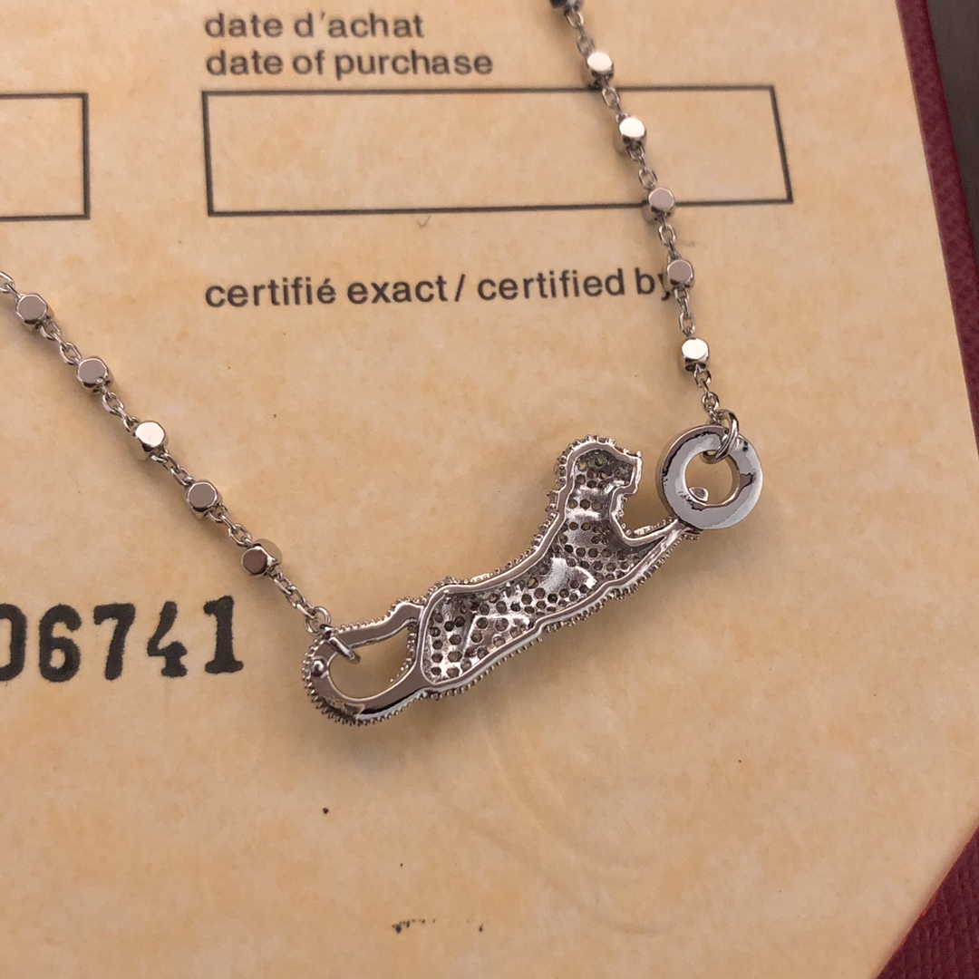 Cartier Panthere de Cartier necklace 18k white gold set with diamonds black onyx spots tsavorite garnet eyes 42cm
