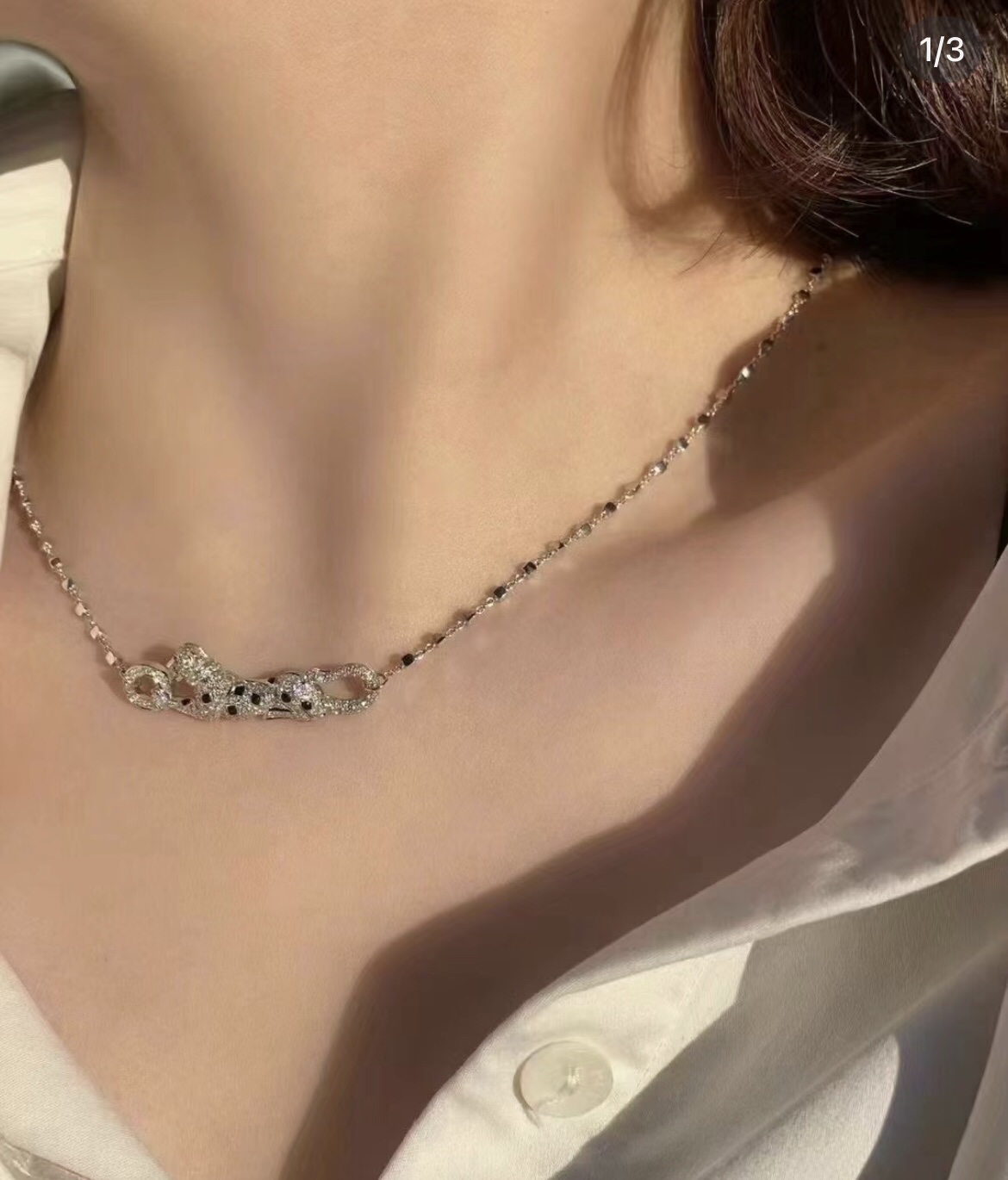 Cartier Panthere de Cartier necklace 18k yellow gold paved clear diamonds black onyx spots tsavorite garnet eyes 42cm