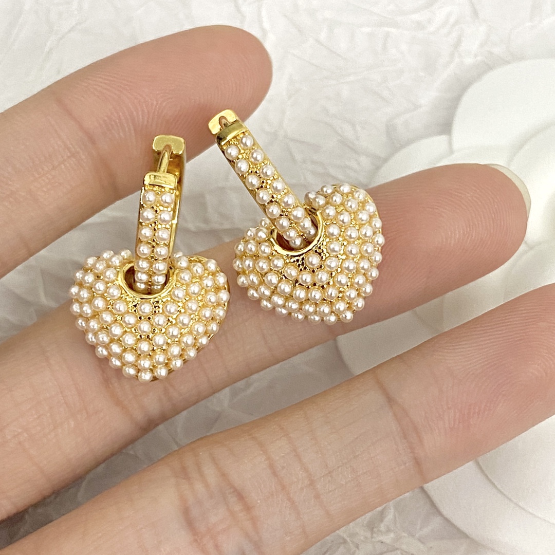Celine Pearl Heart Charm Huggie Hoop Earrings earrings gold-tone metal with white faux pearl accents 1 5cm hoop diameter 1 2cm heart charm drop