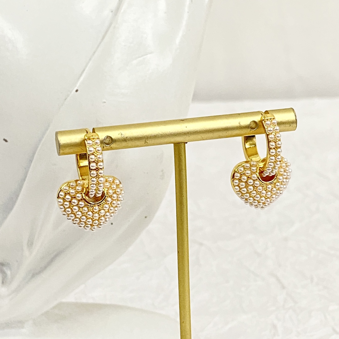 Celine Pearl Heart Charm Huggie Hoop Earrings earrings gold-tone metal with white faux pearl accents 1 5cm hoop diameter 1 2cm heart charm drop