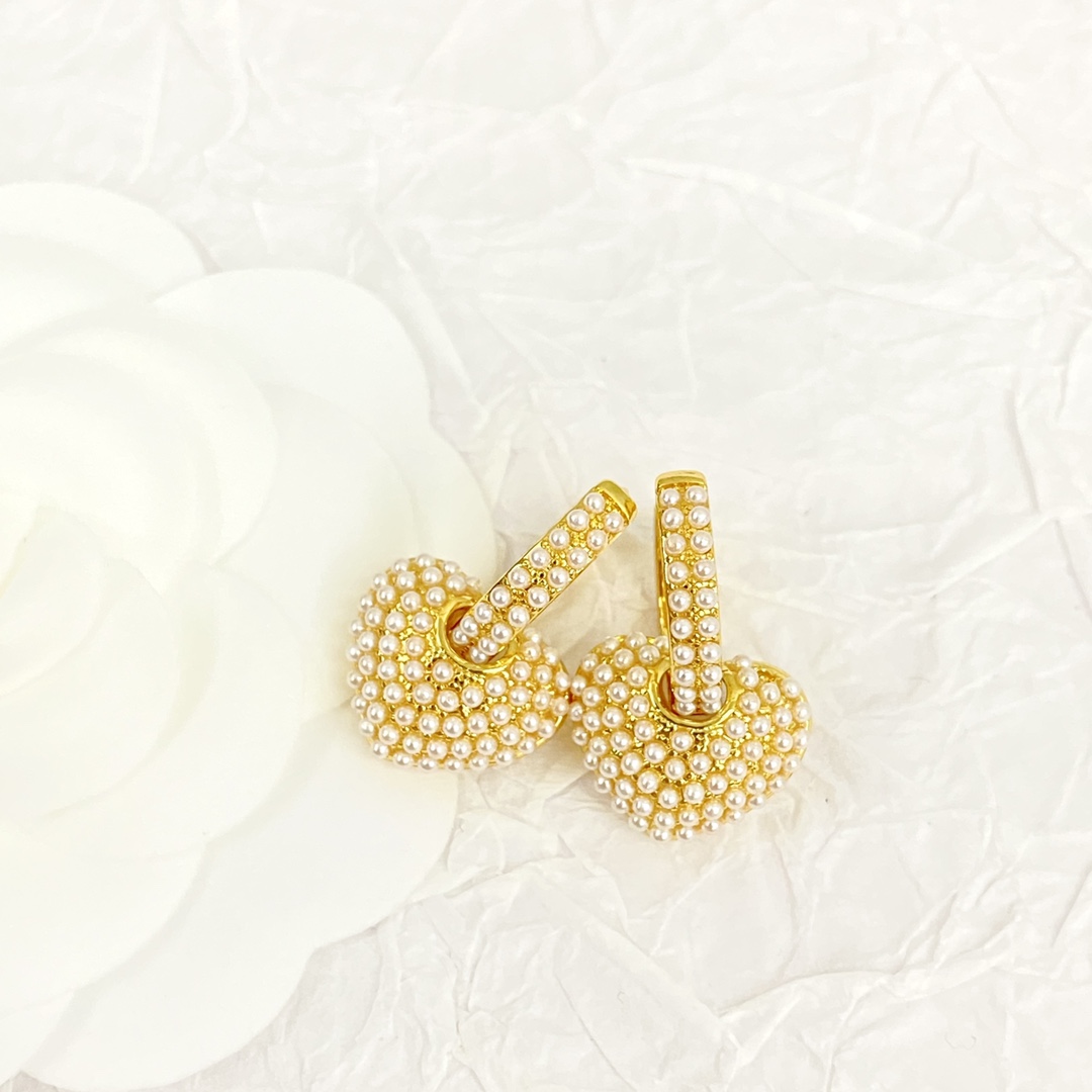 Celine Pearl Heart Charm Huggie Hoop Earrings earrings gold-tone metal with white faux pearl accents 1 5cm hoop diameter 1 2cm heart charm drop