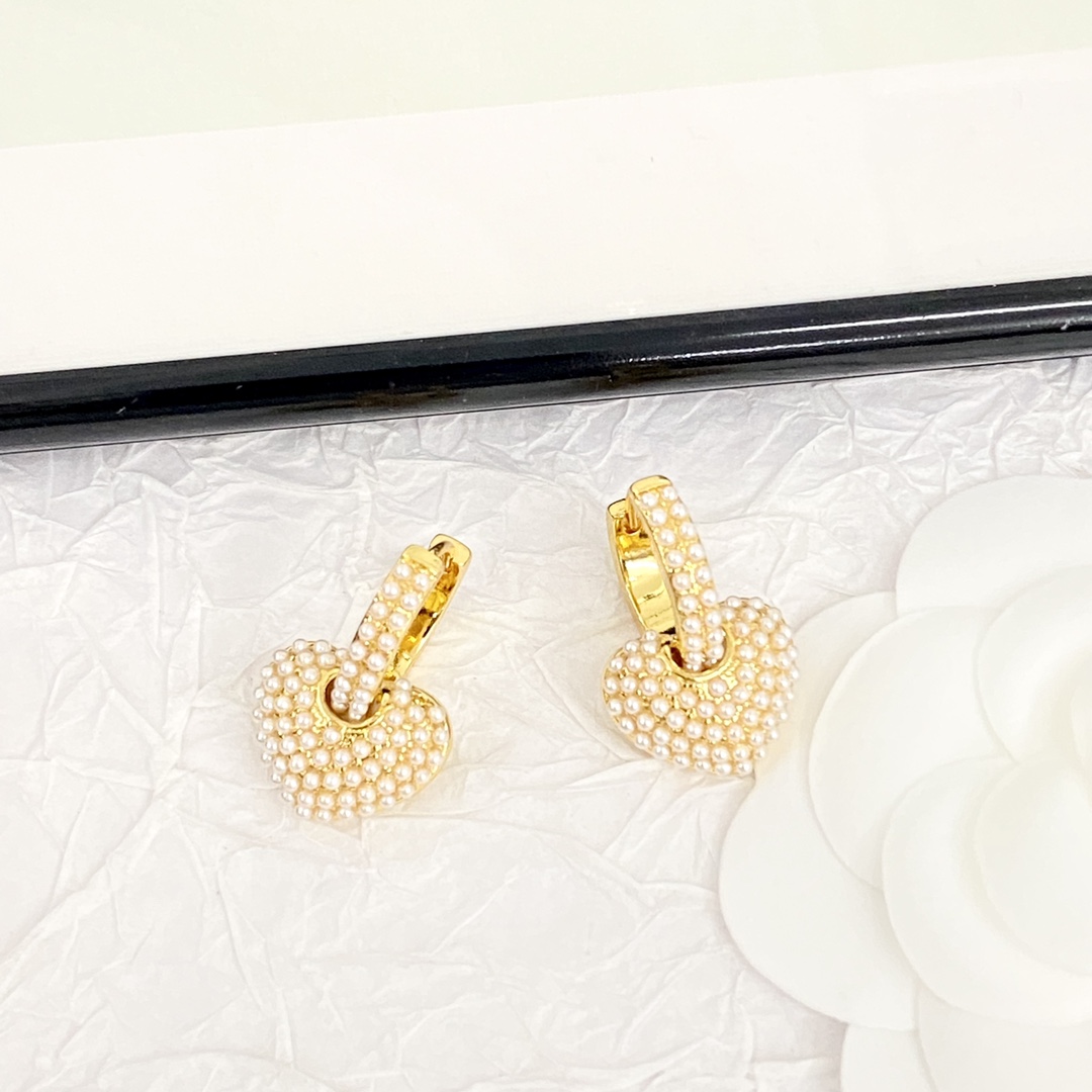 Celine Pearl Heart Charm Huggie Hoop Earrings earrings gold-tone metal with white faux pearl accents 1 5cm hoop diameter 1 2cm heart charm drop