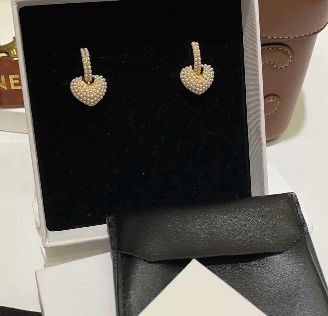 Celine Pearl Heart Charm Huggie Hoop Earrings earrings gold-tone metal with white faux pearl accents 1 5cm hoop diameter 1 2cm heart charm drop
