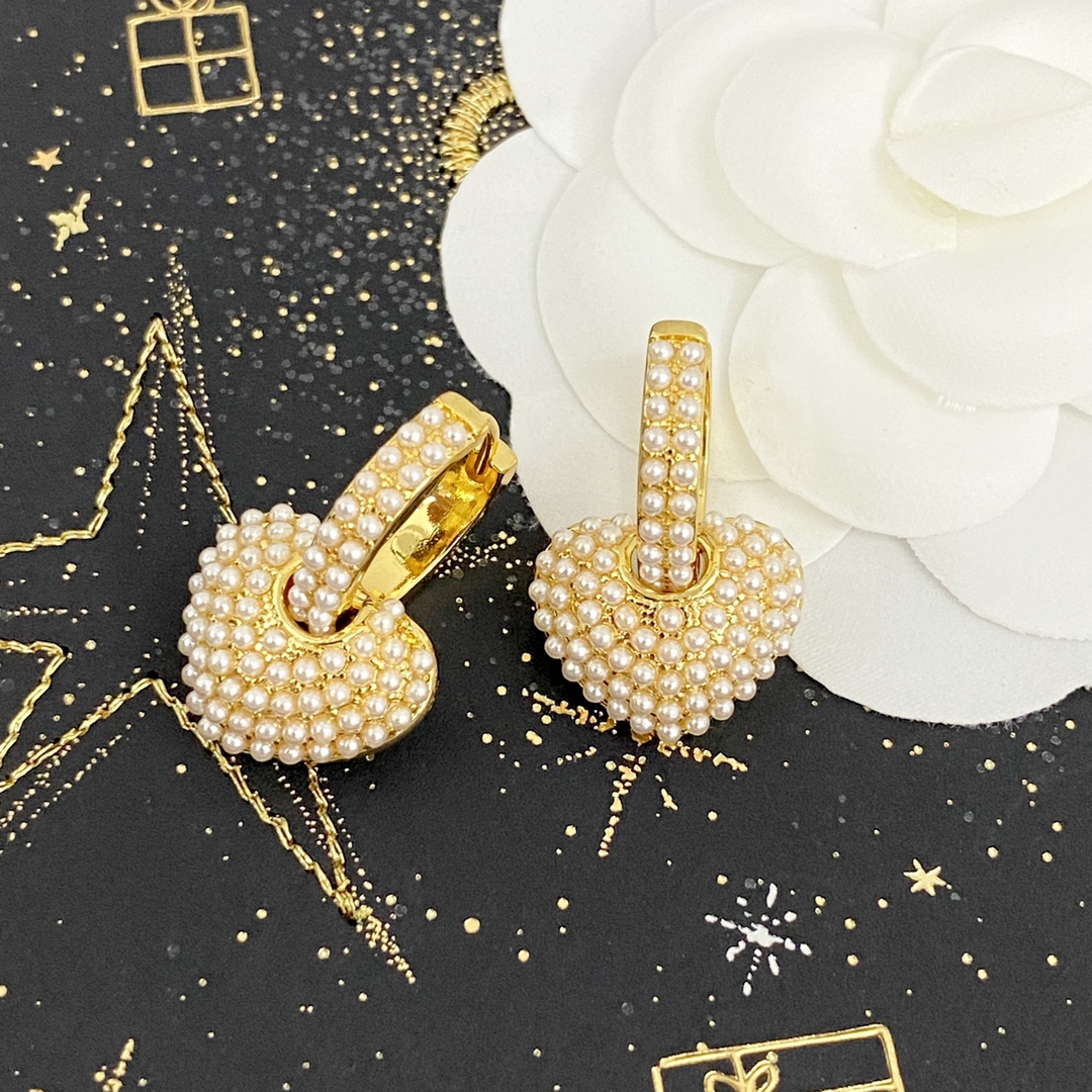 Celine Pearl Heart Charm Huggie Hoop Earrings earrings gold-tone metal with white faux pearl accents 1 5cm hoop diameter 1 2cm heart charm drop
