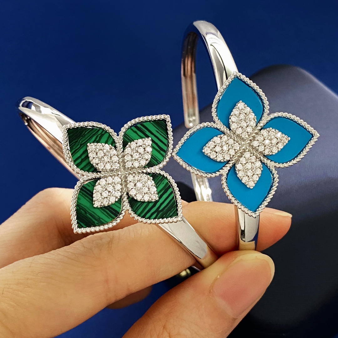 Van Cleef Arpels RC80 bracelet silver-toned metal with diamond-paved flower centers available with green malachite white mother-of-pearl black onyx turquoise blue and dark blue lapis lazuli petal inlays 17cm