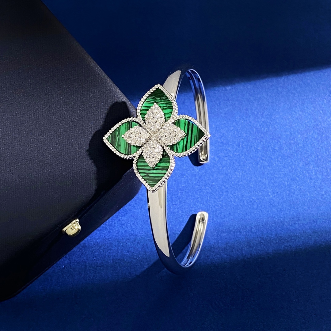 Van Cleef Arpels RC80 bracelet silver-toned metal with diamond-paved flower centers available with green malachite white mother-of-pearl black onyx turquoise blue and dark blue lapis lazuli petal inlays 17cm